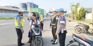 Personel Subdenpom I/5-1 Belawan Turut Bantu Polri di Operasi Patuh Toba 2025